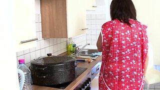 Housewife jerks off with a dildo in the kitchen