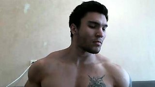 Muscled hunk shows off his body and strokes his big dick