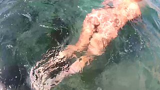 Big breasted MILF seductress posing naked underwater