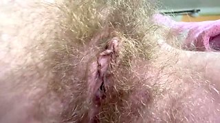 Cute Amateur Blonde Smoking Cigar and Showing Hairy Bush Close Up