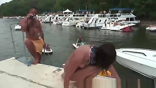 Group of drunk party girls dancing around on a boat