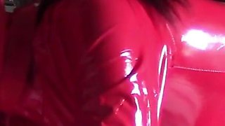 MILF in Red Latex Suit and Patent Leather High Heels Gives a Blowjob with Swallow