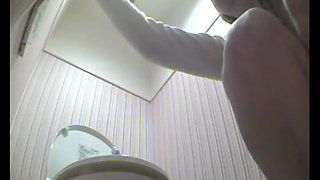 Pissing voyeur porn presents a lusty Asian babe in the toilet.