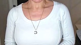 Busty babe playing with her big boobs