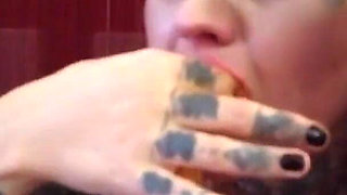 Blonde tattooed milf eats spaghetti on the toilet