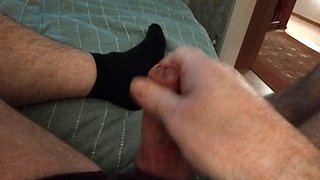 Dad is lying on the couch playing with his cock, jerking off his cock