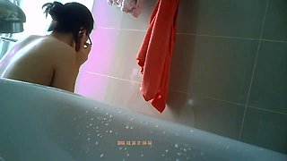 Innocent asian spy in a bathroom