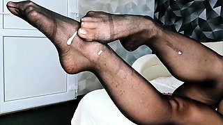 Foot fetish mistress in nylons brings a cock to orgasm