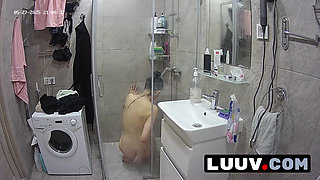 LUUV. Tattooed Alice gets ready for the evening reality show segment in the shower