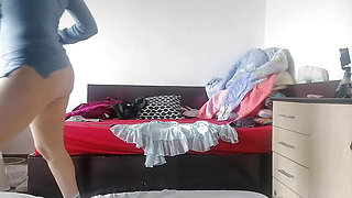 Amateur wife has fun trying on clothes that she cuts herself. Amateur wife dances naked around the house.