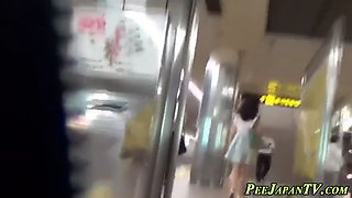 asian lady pees in toilet