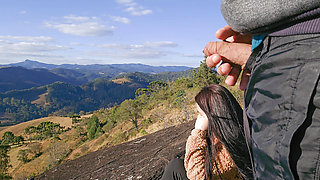 Tour Guide Shows Stick to Tourist on Mountain
