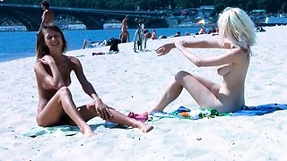 Beautiful blonde nudist sunbathe her trimmed pussy