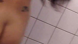 Inked German beauty is pleasuring her cunt in the bathroom