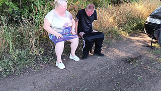 A neighbor sucks my dick in a public park on a bench until I cum