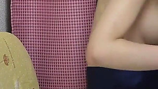 Natural Tits, Legs and Thong of Japanese Girl Sitting on Chair in Apron-style Miniskirt Uniform Are Observed From Under the Desk