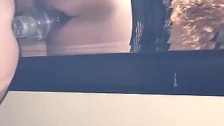 Slut Rides Huge Dildo While Sucking Cock
