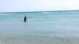 On a nudist beach I meet a guy masturbating and I help him