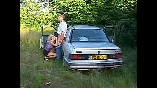 Busty MILF Gets Fucked on the Hood of the Car by a Big Cock That Cums in Her Mouth