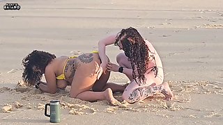 TWO LESBIAN CHICKS PLAYING ON THE BEACH GOT PICKED UP BY A TOURIST AND HAD THEIR ASSES FUCKED