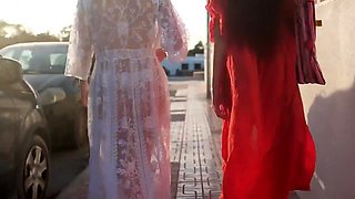 In a kitchen a sexy brunette playing with her big boobs