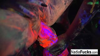 Nadia White : Black-light babes Nadia and Ophelia suck off a colorful cock