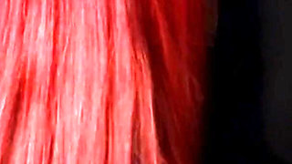 Redhead nurse sucks cock at a gloryhole