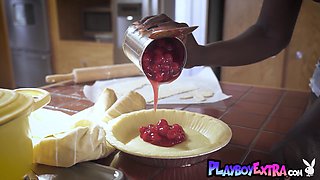 Provocative ebony young cutie cooking and stripping