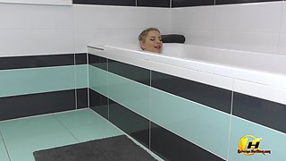 Boobs and Clit Play in Tub Full of Stick