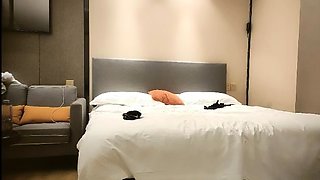 Cute amateur asian web cam girl playing with her toy