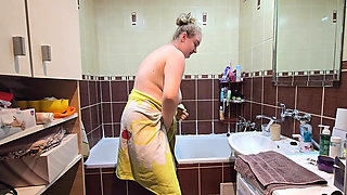 Blonde BBW Wife Enjoys a Hot Shower in the Bathroom