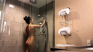Sexy amateur chick taking a shower and masturbating