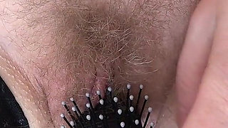 Mature Hairy Pussy Cums From a Comb Close-up. Amateur Fetish with a Plump Pubic Mound and Bush.