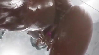 She plays with her pussy in her shower