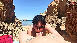 Blowjob with cumshot on a crowded beach...