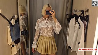 Trying on transparent clothes in the fitting room. Naked blonde flashed her boobs in a public place