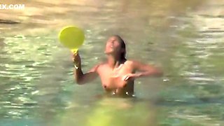 Naked arab girl playing water tennis tanned lines sunbathing