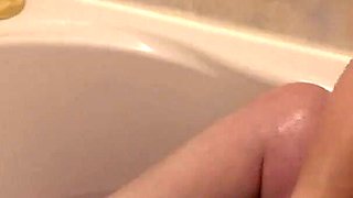 Washing Soapy Breasts in Bath