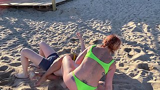 Two Lesbian Hotties Wrestling on the Beach and After That Start Kissing