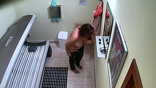 Busty and husky housewife in solarium