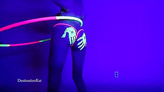 Dances And Hula Hoops Under A Black Light
