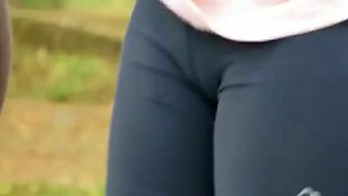 Two sporty girls flash their cameltoe in the street