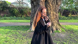 Liz Rainbow Smoking a Flor De Oliva Cigar Outdoors