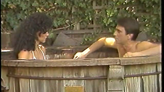 80s porn star Kimberly Carson sucks a hairy dick in a jacuzzi