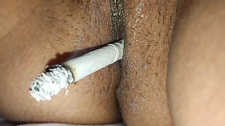 Rajasthani  Neha  Pussy of the Smokes cigarette and gets  fingers inserted in her pussy