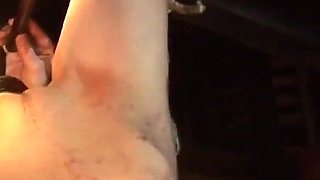 Witch Hangs Upside Down and Gets Drizzled with Black Wax