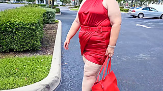 Beautiful Woman Walking Outdoors in  Parking Lot Showing off for Strangers
