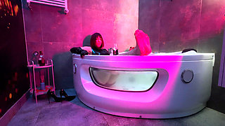 Mistress' Taking a Bath in Latex and Boots