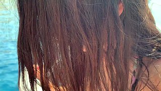 HOT BRUNETTE IN A BIKINI GETS AN ORGASM ON YACHT WHITH