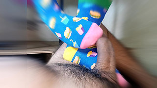 straw with feet wearing very funny stockings